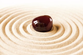 Stone on sand